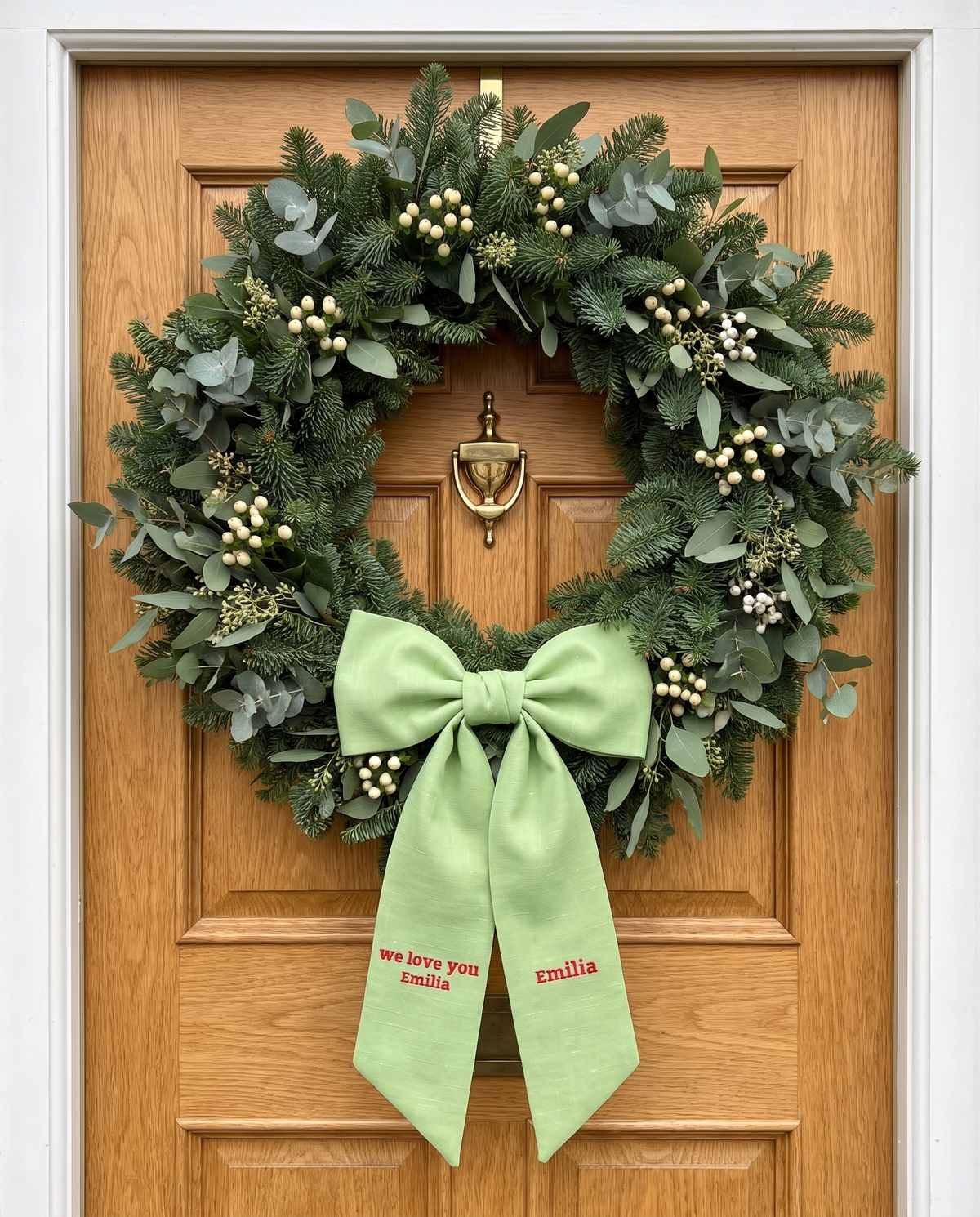 Apple green bow sash on wooden door wreath