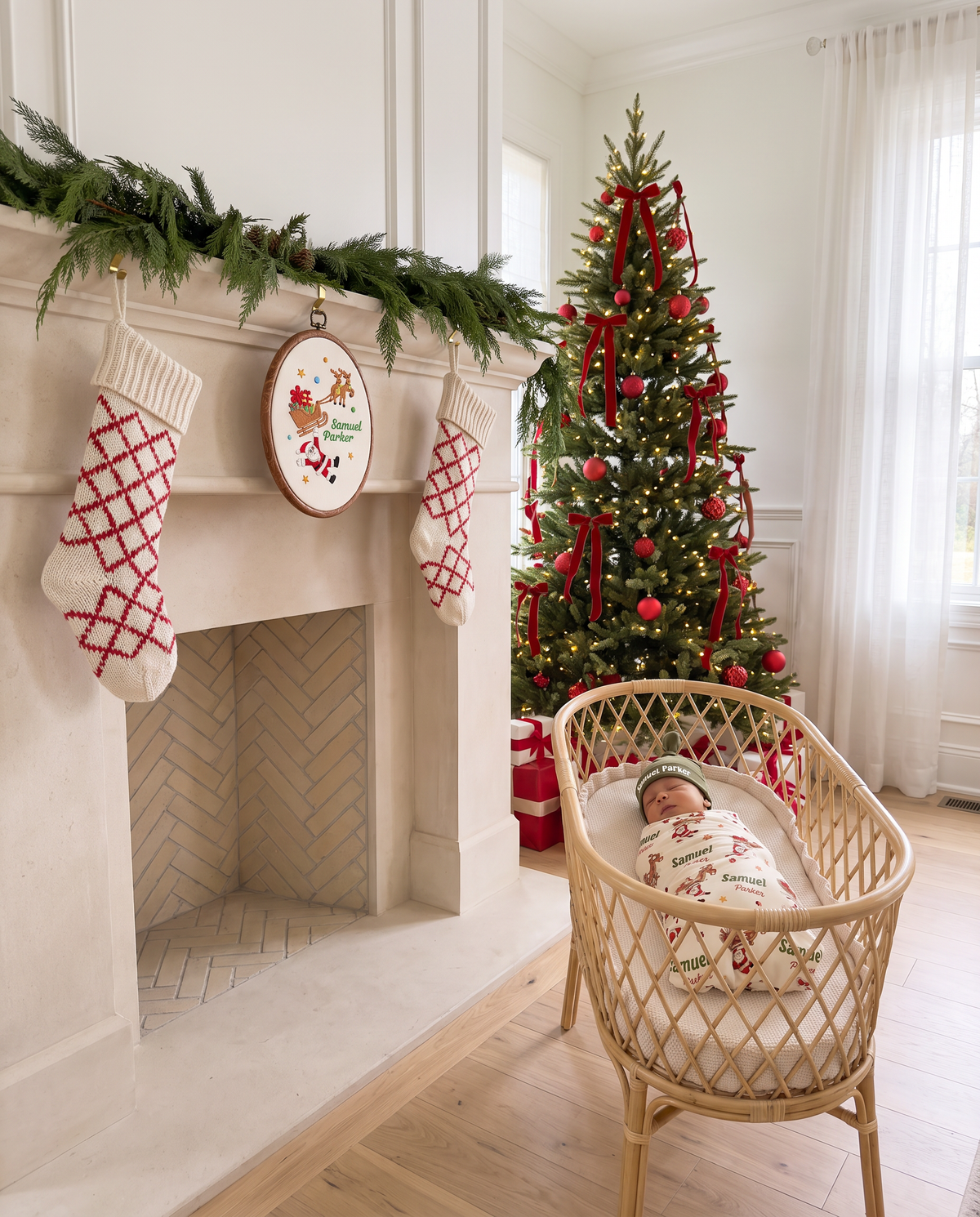 Embroidered hoop sign hanging on the mantel between stockings, bassinet by the fireplace