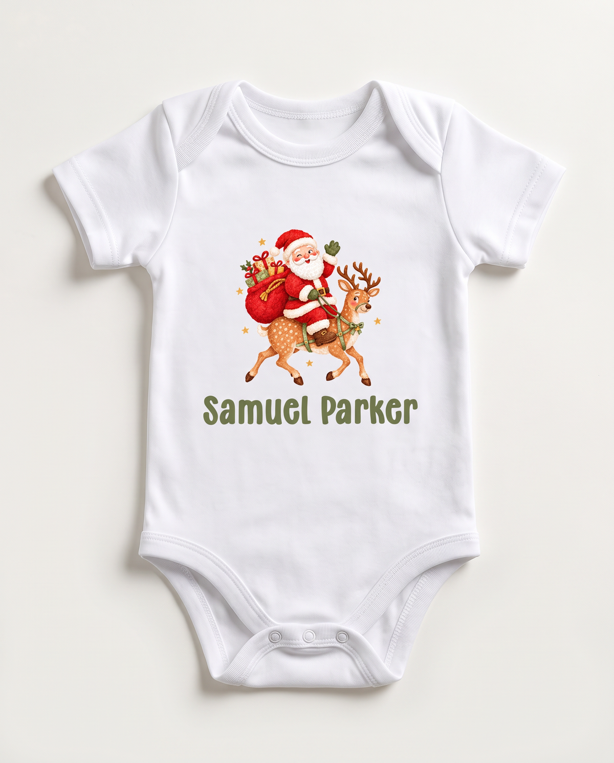 White graphic bodysuit with Santa riding a reindeer and the baby's name, on white
