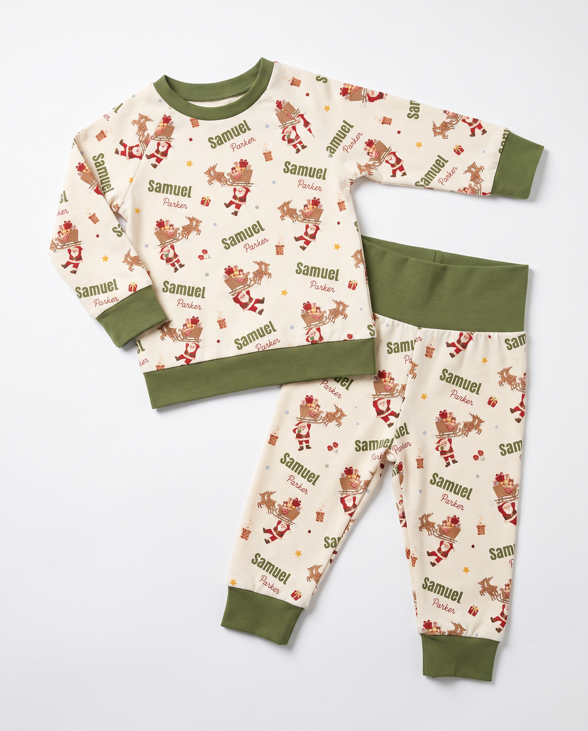 Personalized Santa's Joyride baby pajama set with olive cuffs and waistband, on white