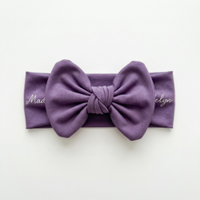 Every swaddle has a matching hat, bow and sign