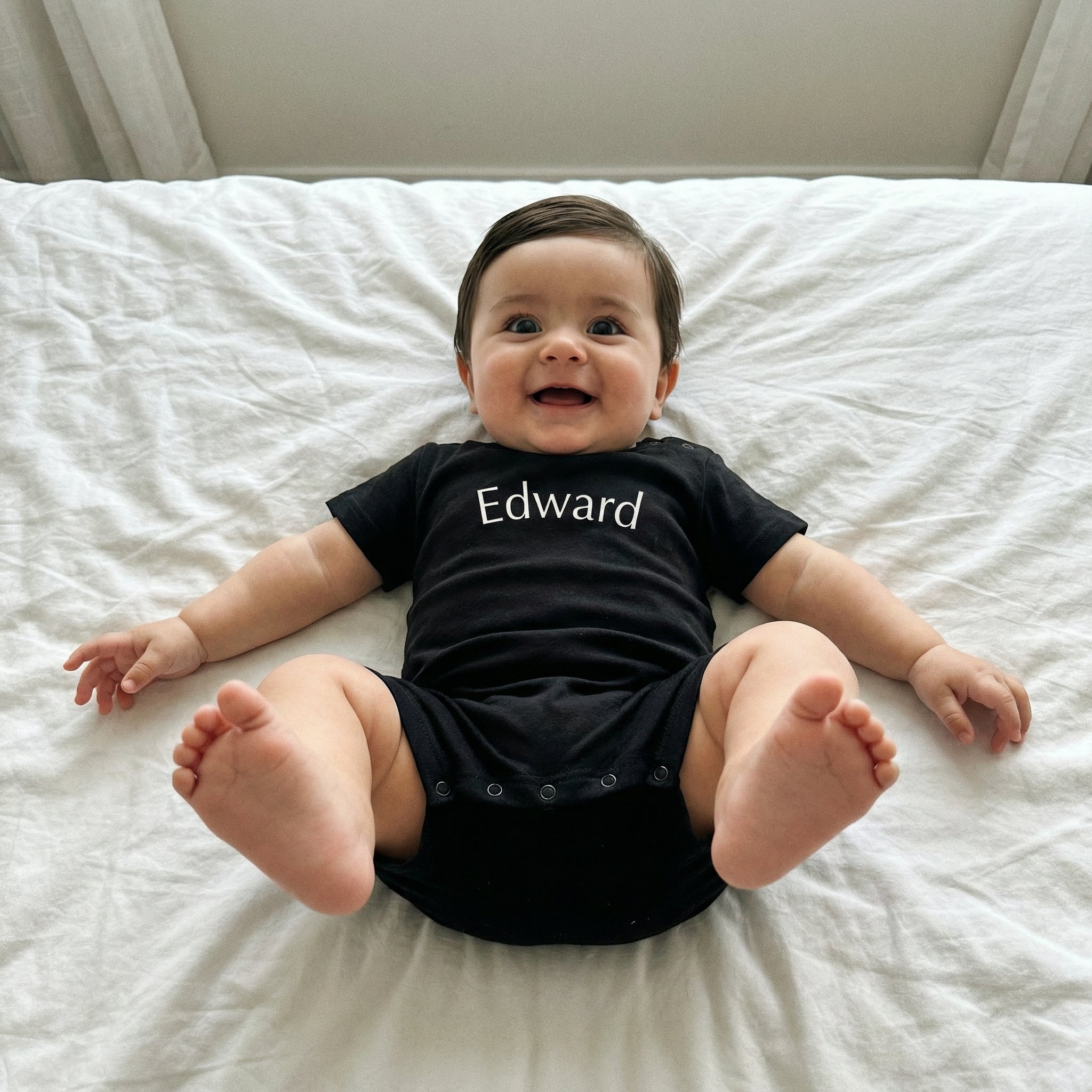 Embroidered Short Sleeve Snap Romper in Black