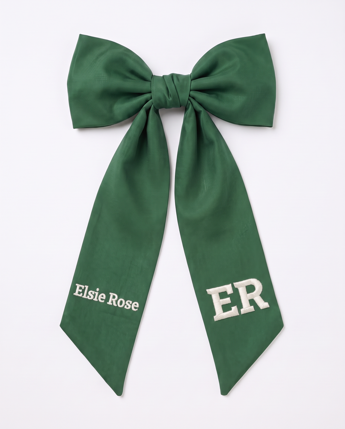 Forest green bamboo newborn bow sash with white embroidery on both tails, on white
