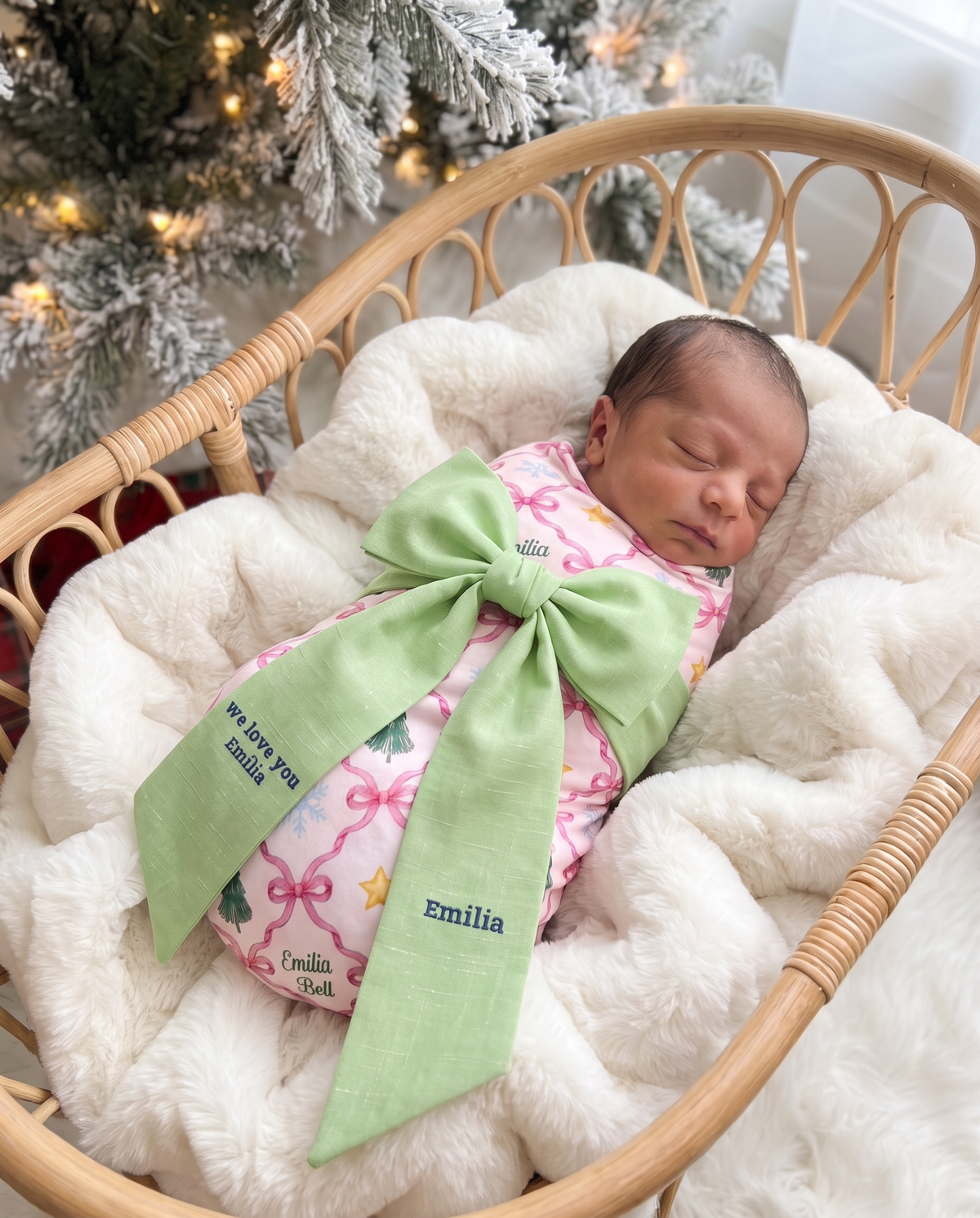 Newborn wrapped with apple green bow sash