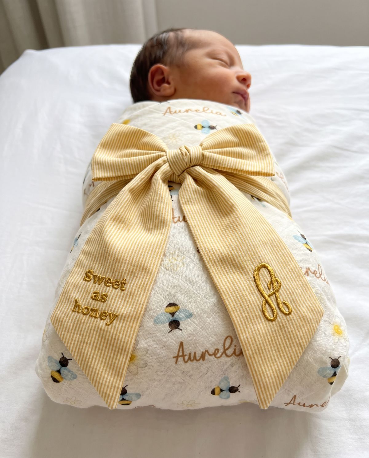 Embroidered newborn bow sash in striped yellow with Bee swaddle