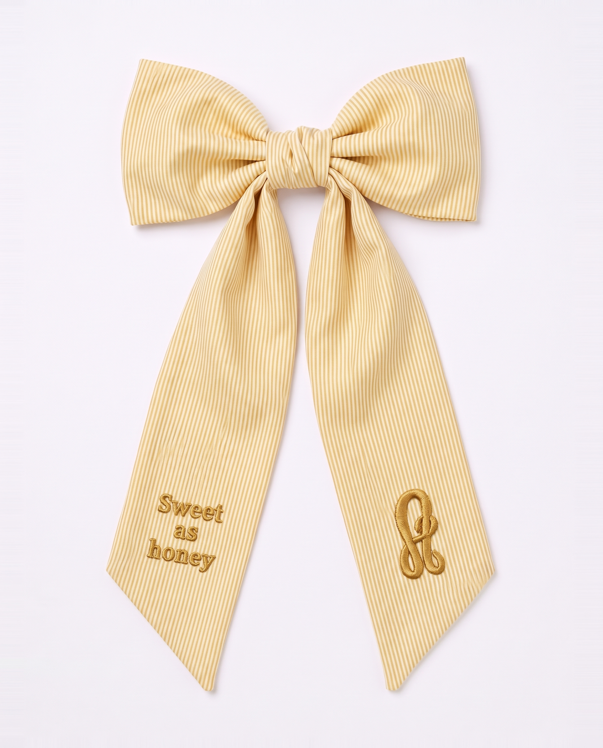 Striped yellow bow sash tied, white background