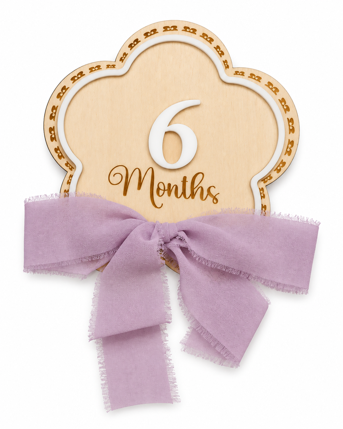 Flowers milestone wood sign reading 6 Months with a lilac ribbon bow on a white background