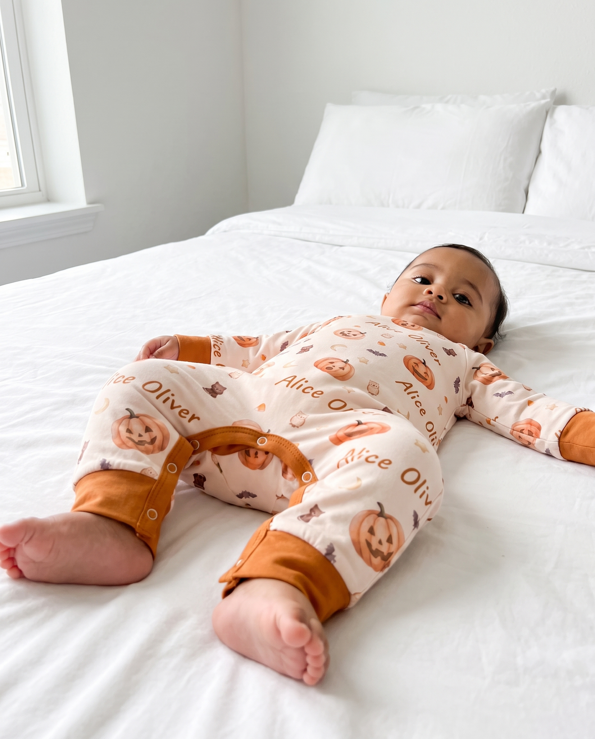 Low angle view showing U-shaped placket and ankle cuffs of the Golden Jack snap romper