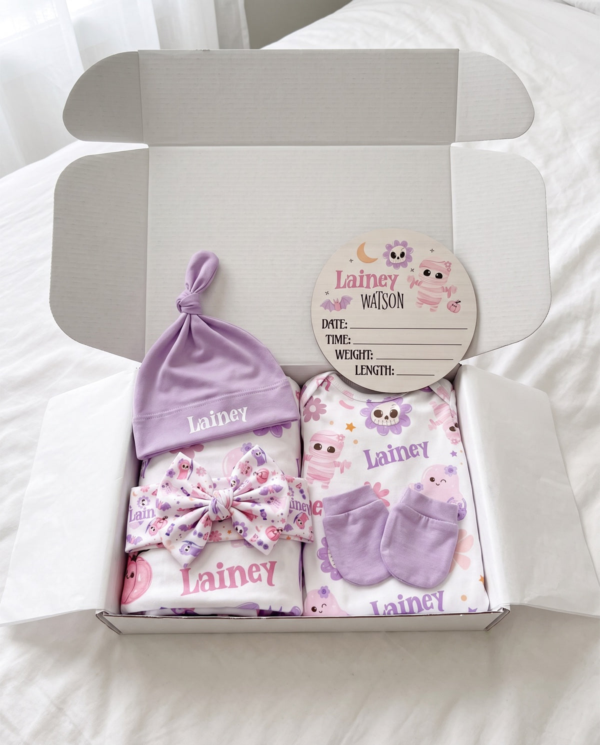 Blush Boo gift set unboxed showing all personalized pieces laid out with the gift box, name Lainey