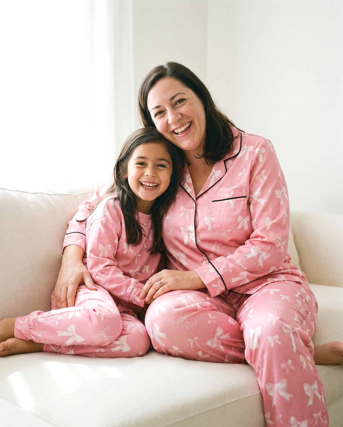 Mother and child in matching Pink Coquette Bow pajamas