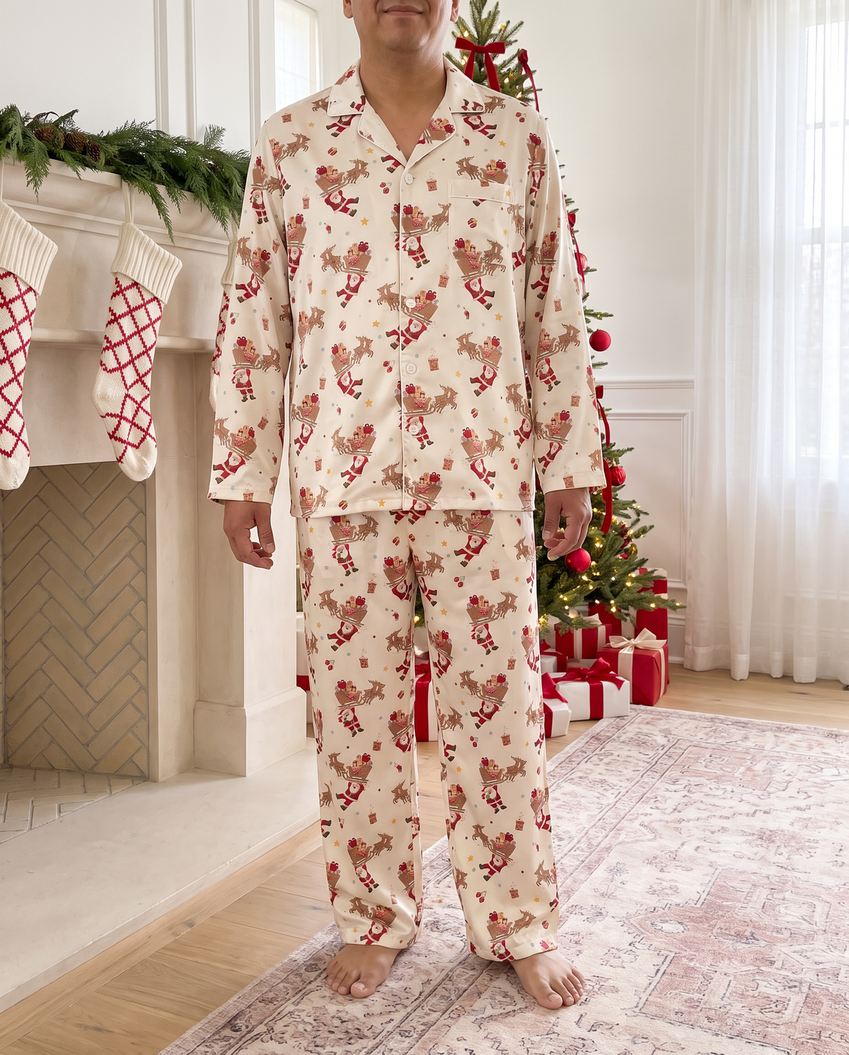 Man in the full Santa's Joyride pajama set standing by the fireplace