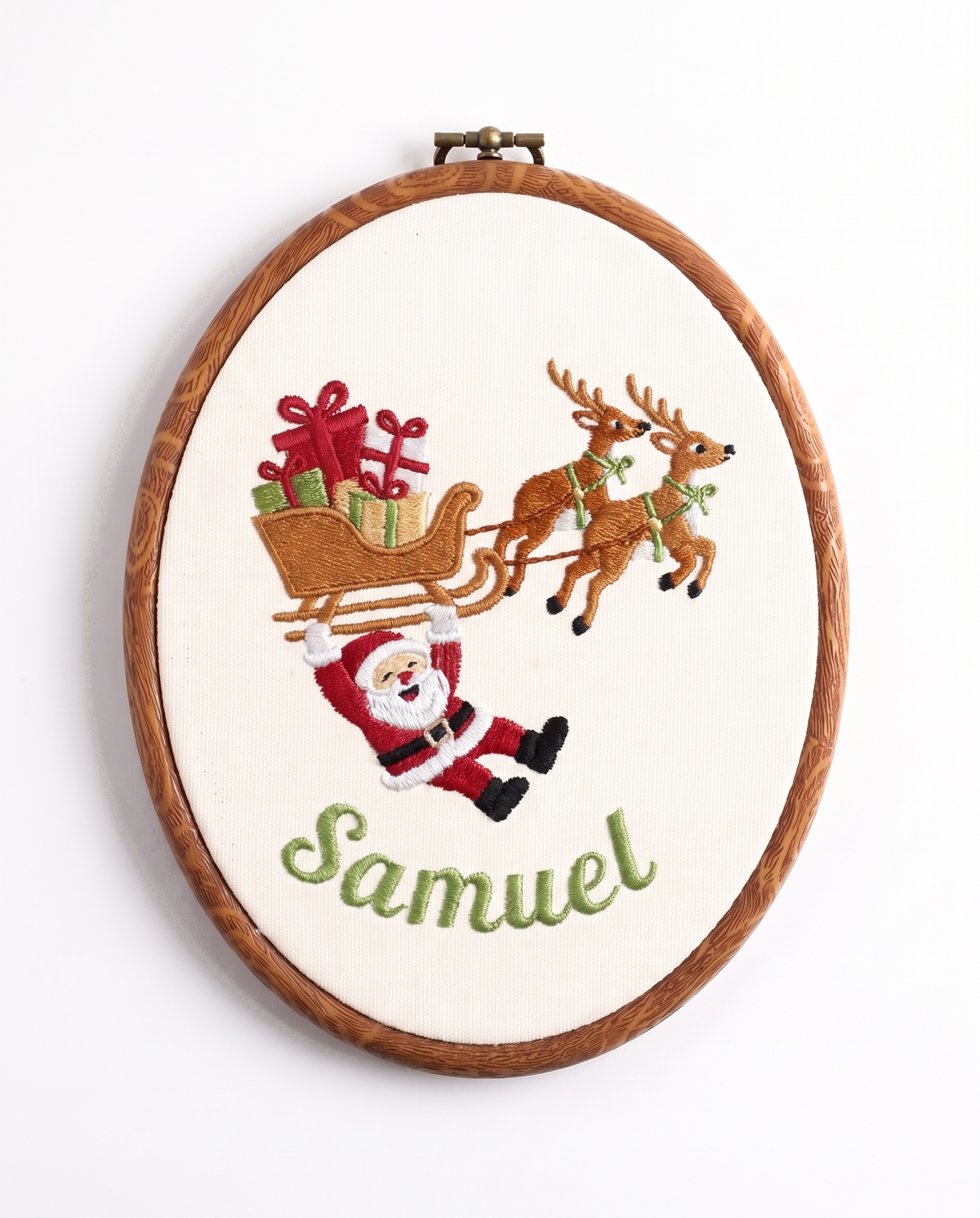 Embroidered hoop sign with Santa hanging from the reindeer sleigh and first name, design 2
