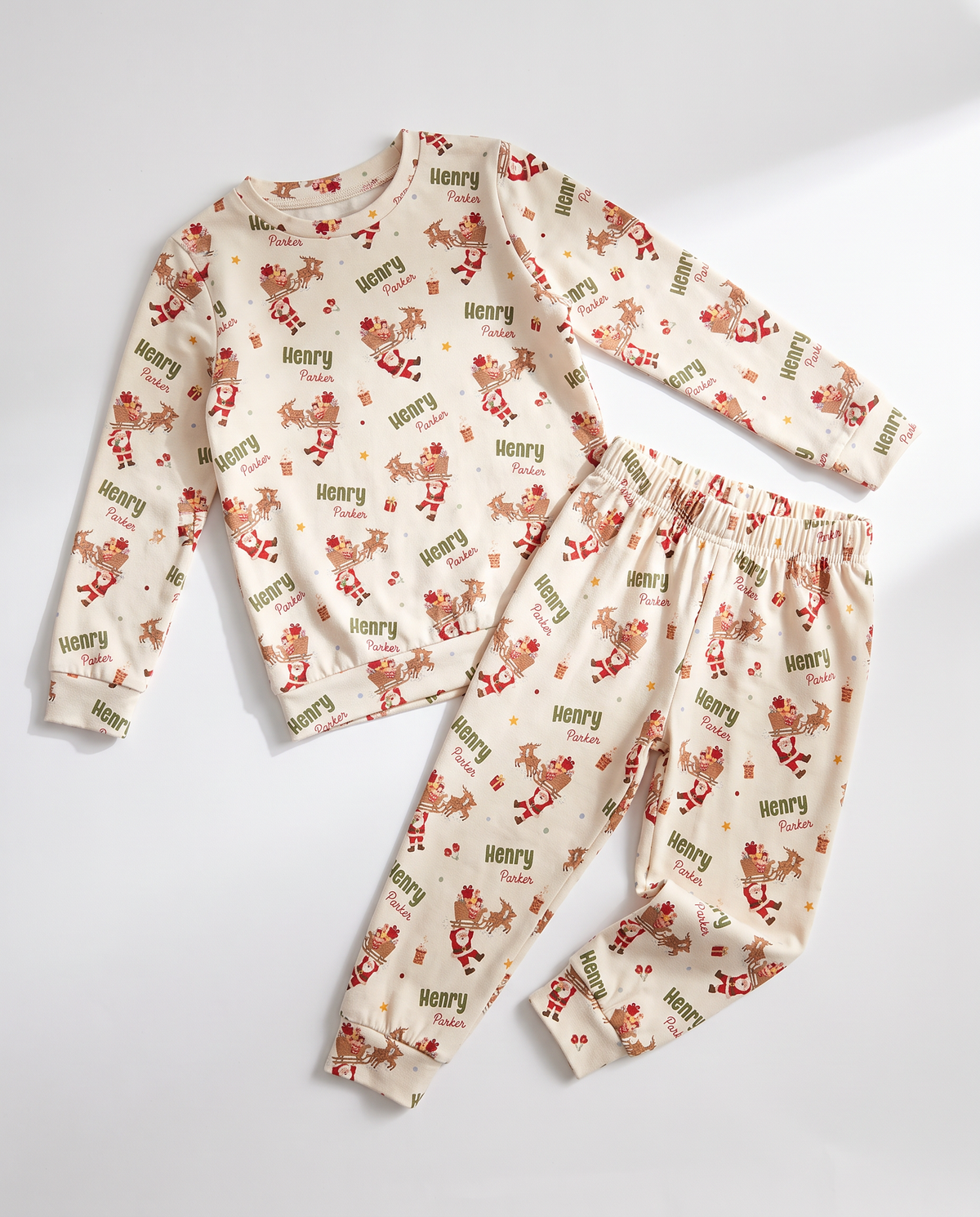 Personalized Santa's Joyride two piece pajama set for kids with name print, on white