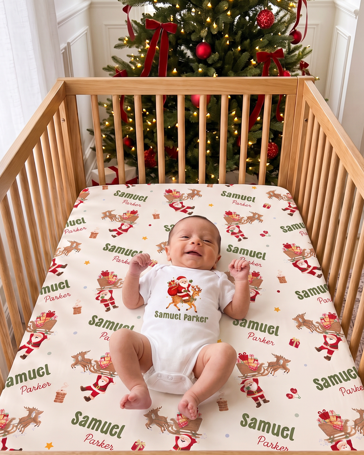 Baby in a Santa graphic bodysuit lying on the Santa's Joyride crib sheet in a wooden crib