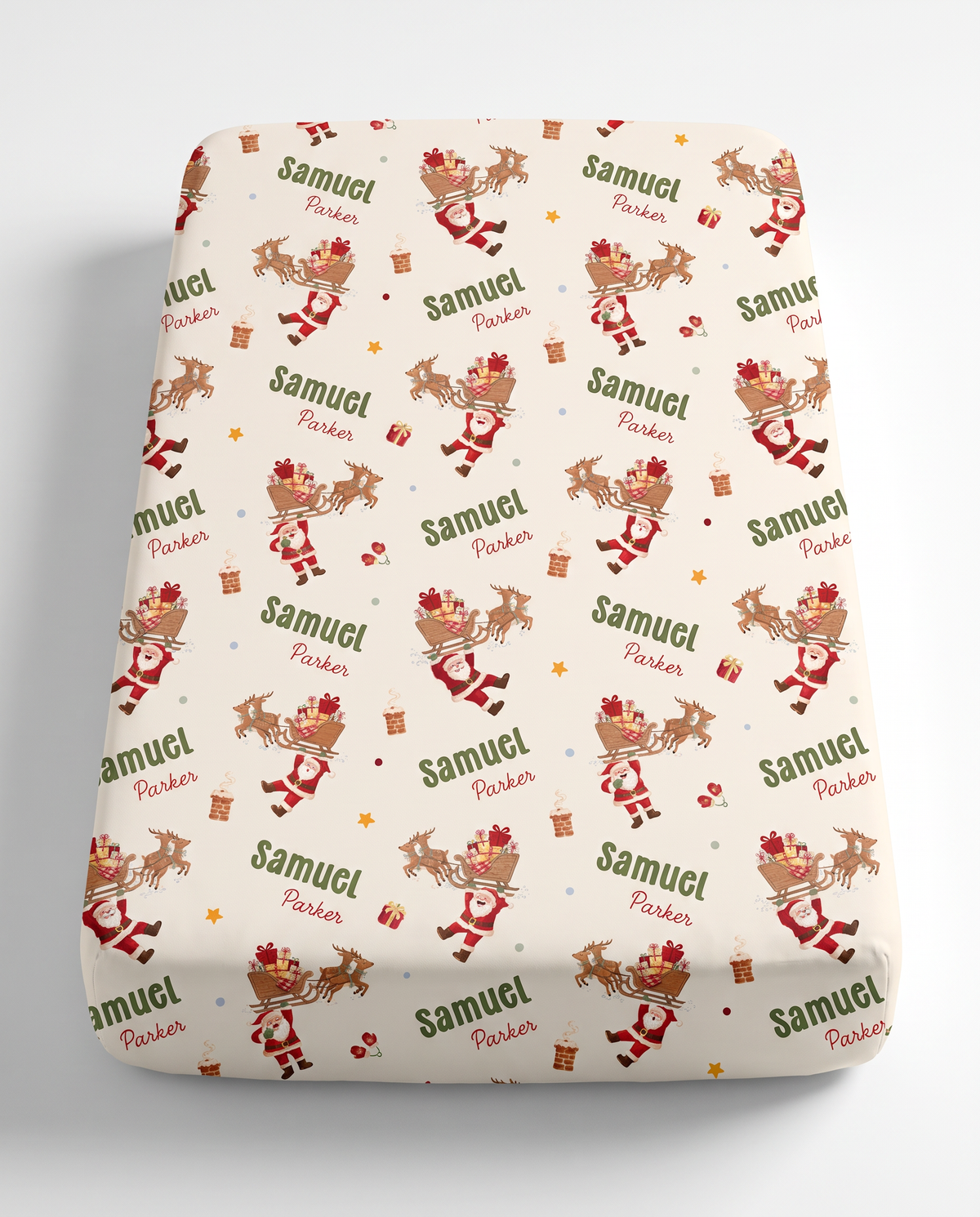 Personalized fitted crib sheet in Santa's Joyride print with baby's name, on white