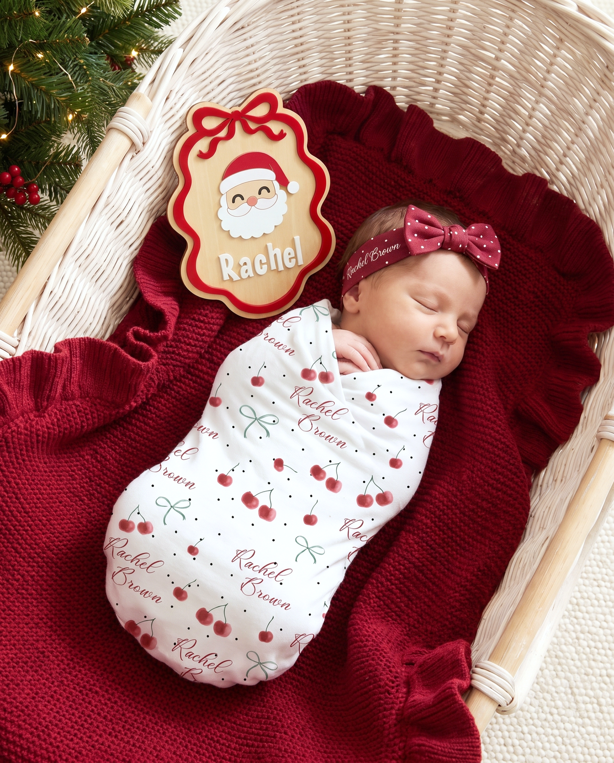 Ribbon Santa personalized wood announcement sign resting at the head of a white bassinet