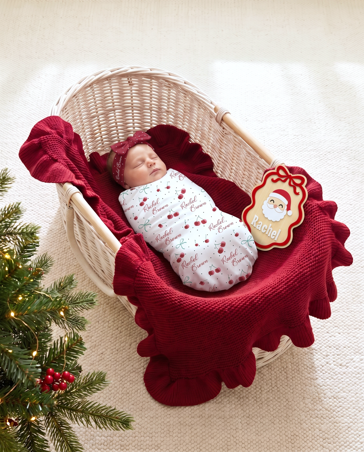 Ribbon Santa wood announcement sign with a red ruffle blanket in a woven bassinet