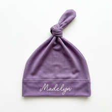 Every swaddle has a matching hat, bow and sign